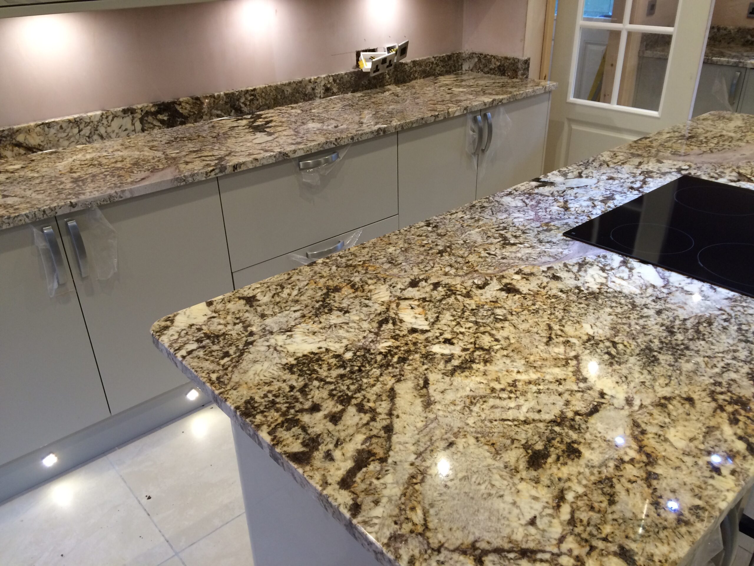 Giallo Antique granite island with rebated hob and matching upstands in Aspley, Huddersfield