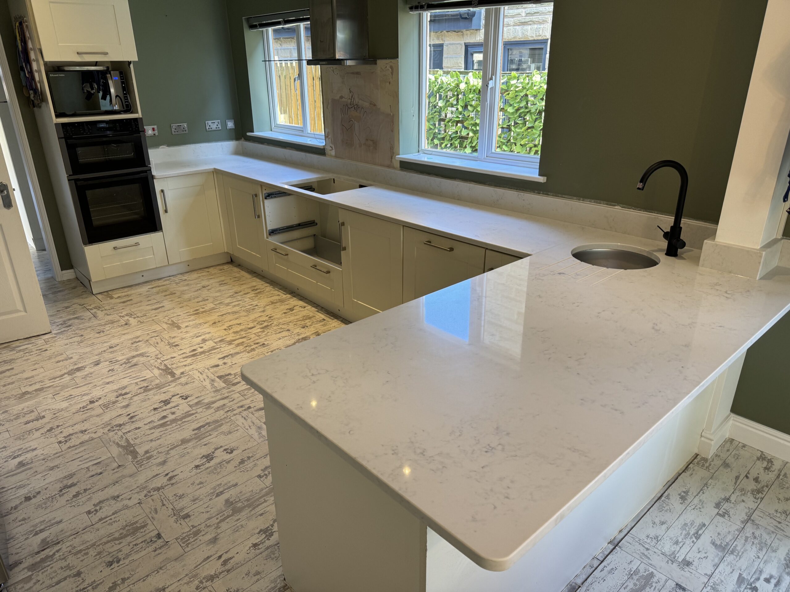 Carrara white quartz breakfast bar with round undermounted sink in Halifax