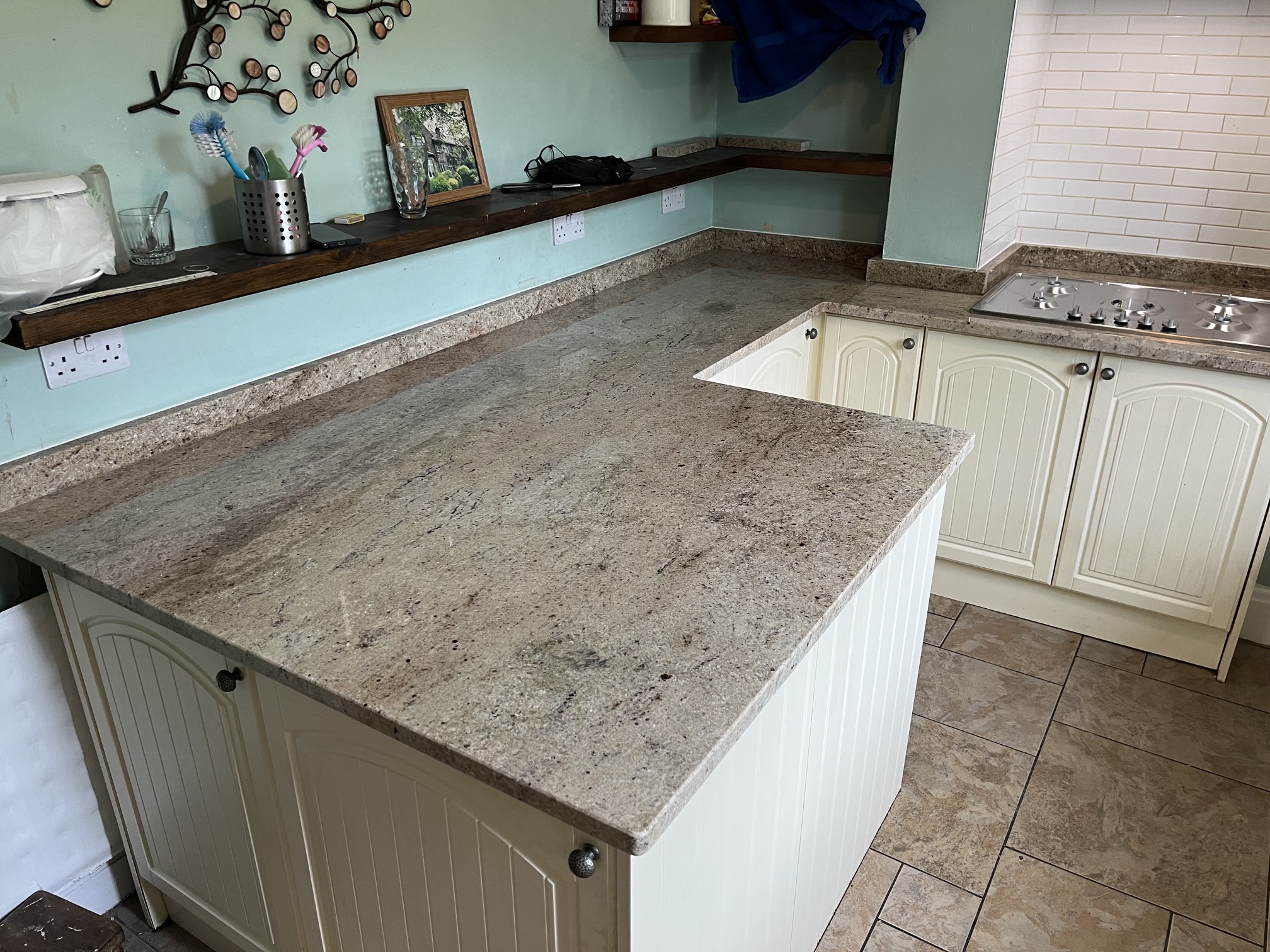 New Venetian Gold granite worktops and breakfast bar with matching upstands in Yeadon
