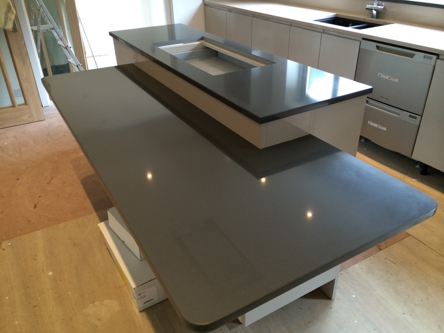 Granite and Quartz Worktops with a Lower Dining Area in Harrogate