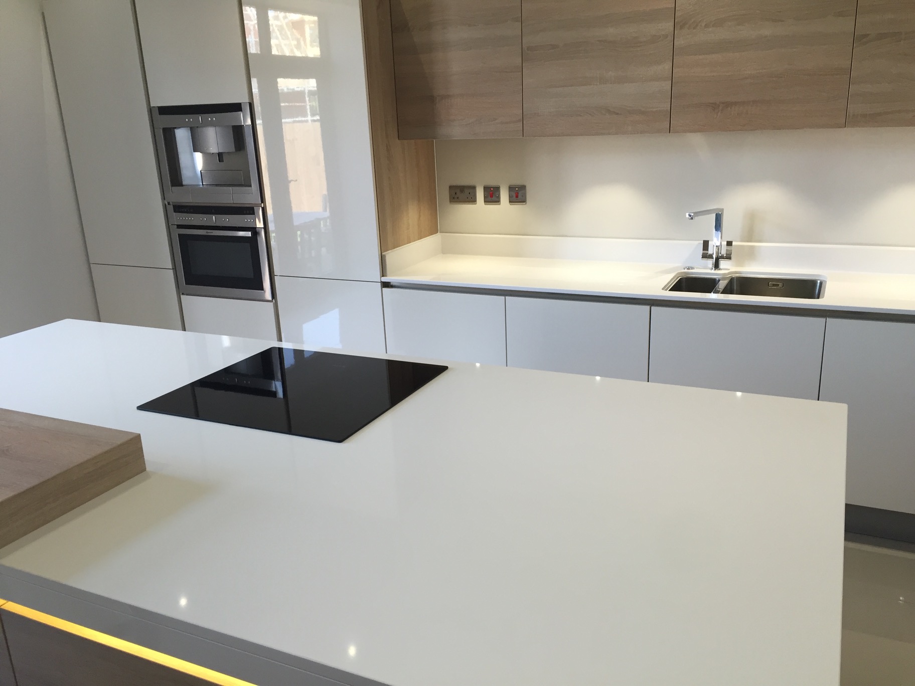 Pure White Quartz Island with Oak Chopping Board in Huddersfield