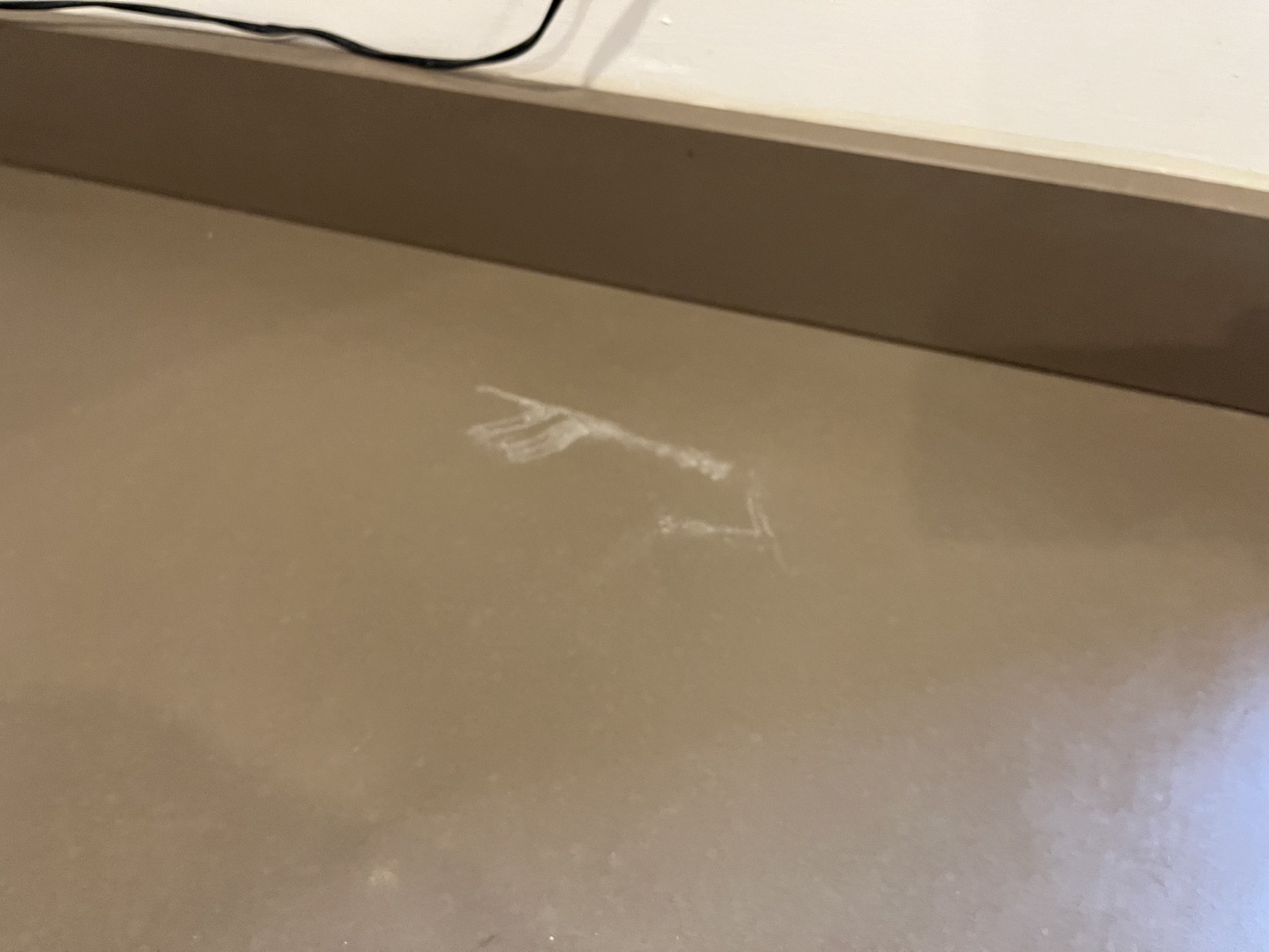 Scuff damage on a quartz worktop before repair in Huddersfield