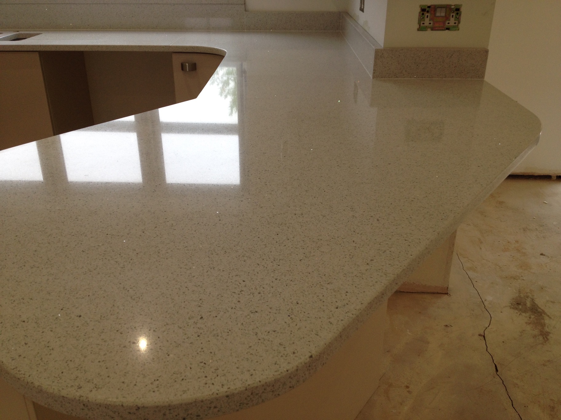 Sparkly White Quartz Worktops with a Curved Breakfast Bar in Pudsey, Leeds